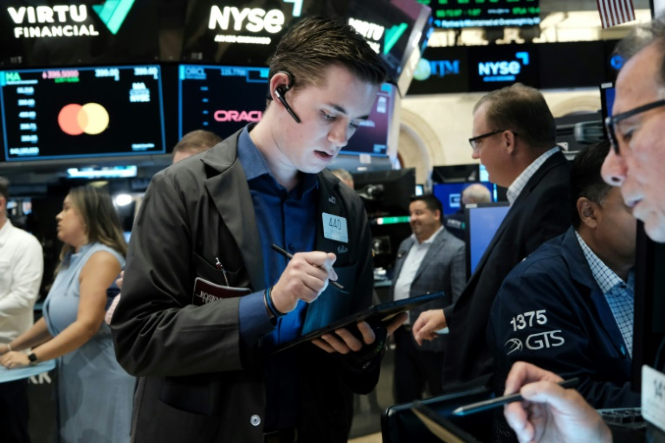 Des opérateurs du New York Stock Exchange © SPENCER PLATT