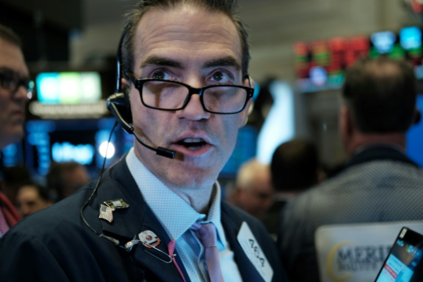 Un opérateur du New York Stock Exchange © SPENCER PLATT