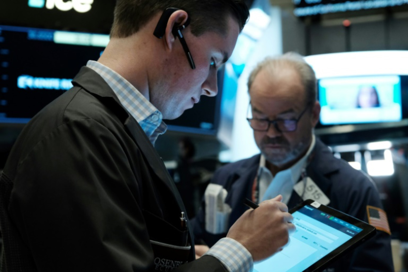 Des opérateurs du New York Stock Exchange © SPENCER PLATT