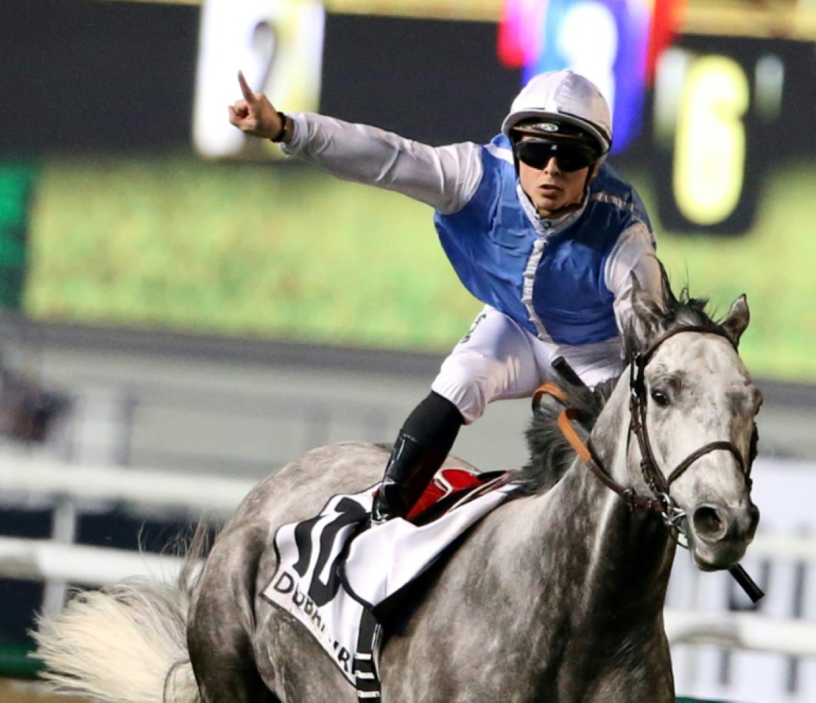 Maxime Guyon fête sa victoire sur Solow le 28 mars 2015 à Dubaï, aux Emirat arabes unis © KARIM SAHIB