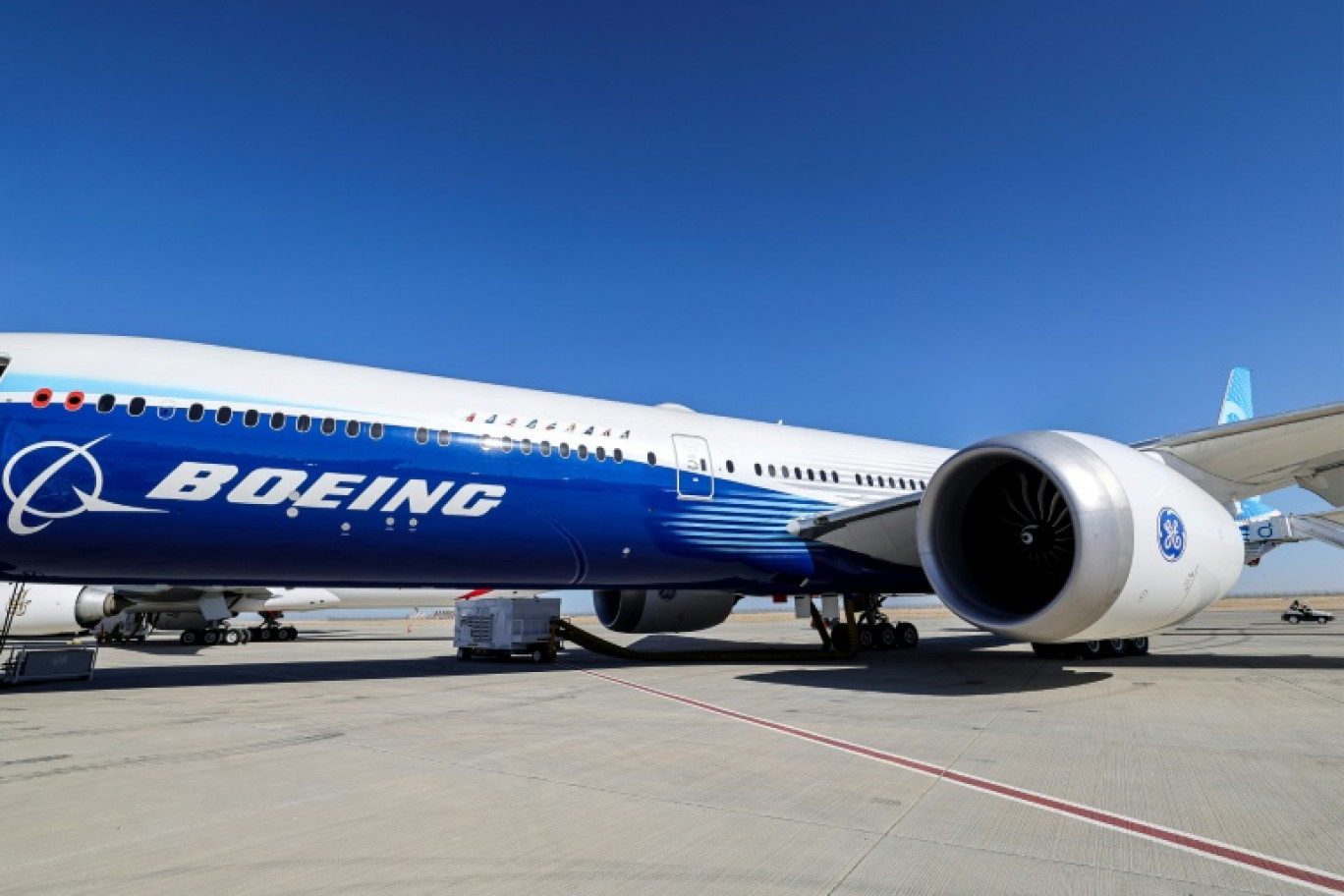 This picture taken on November 13, 2023 shows a view of the fuselage and one of the engines of a Boeing 777-9 jetliner aircraft on the tarmac during the 2023 Dubai Airshow at Dubai World Central - Al-Maktoum International Airport in Dubai. © Giuseppe CACACE