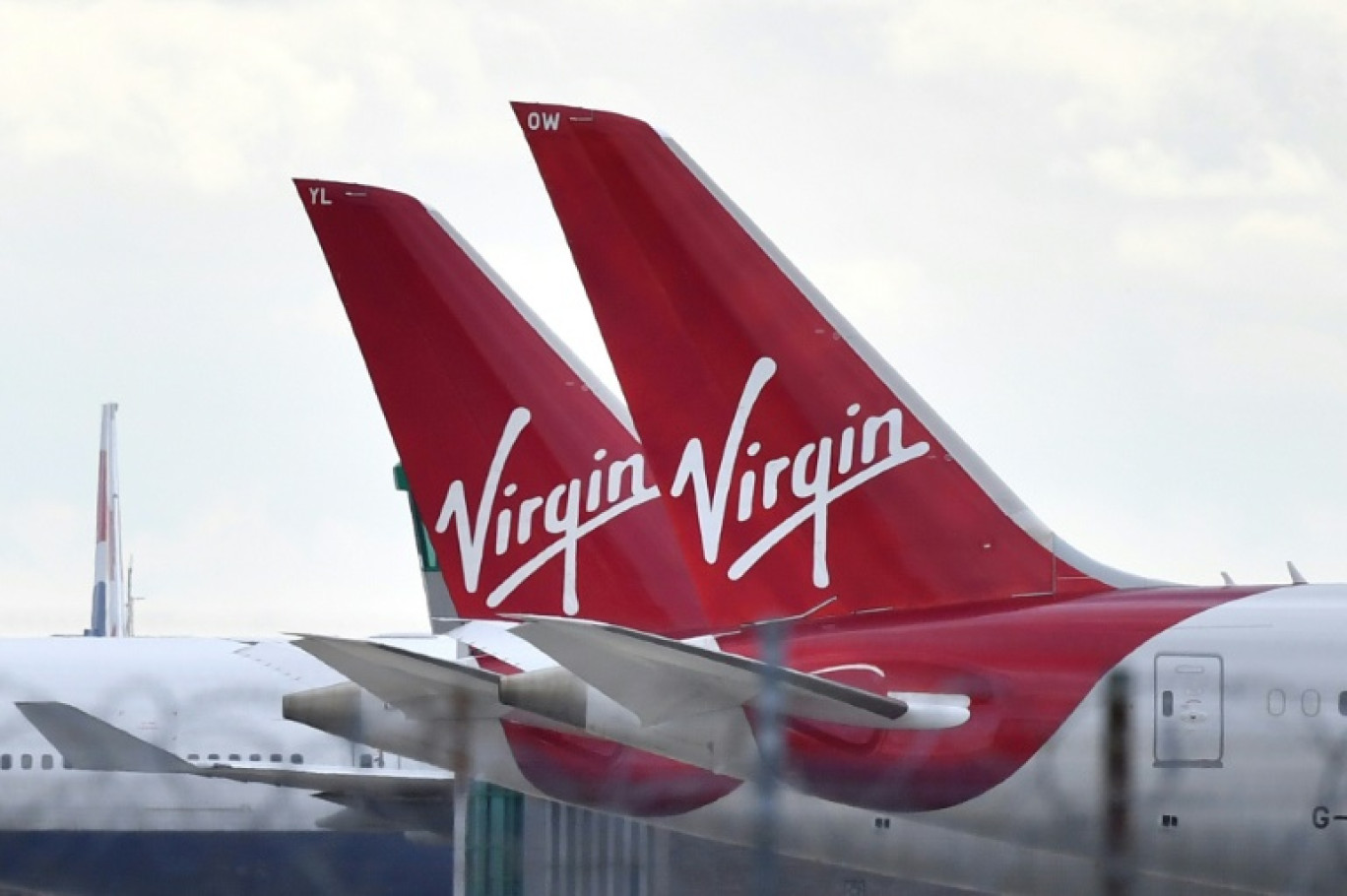 La compagnie aérienne britannique Virgin Atlantic a opéré mardi un vol transatlantique propulsé intégralement aux carburants dits durables, une première, que les organisations écologistes qualifient d'opération de "verdissement de façade" ("greenwashing") © Ben STANSALL