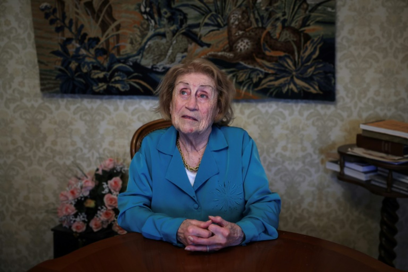 L'autrice française Marie Vaislic-Rafalovitch,  rescapée de la Shoah, dans son appartement à Toulouse, dans le sud-ouest de la France le 21 février 2024 © Valentine CHAPUIS