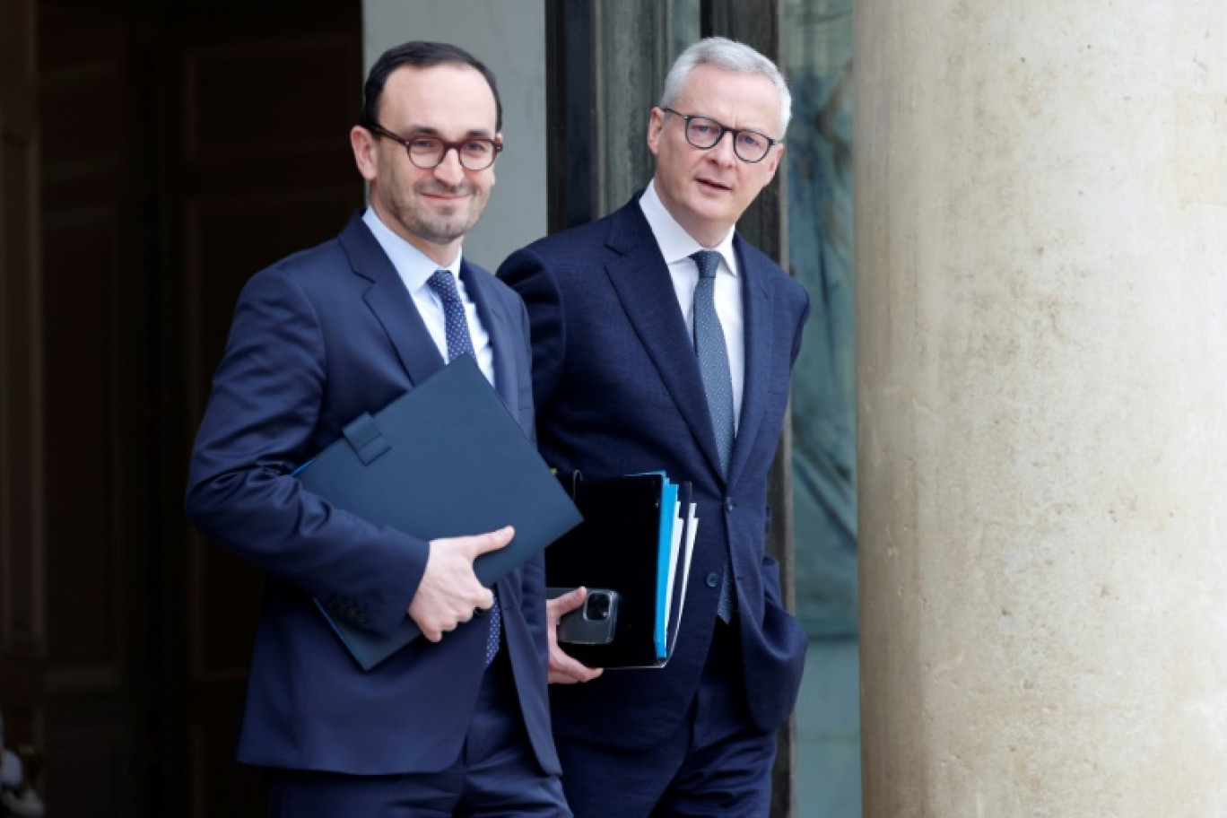 Le ministre français de l'Economie et des Finances Bruno Lemaire et le ministre délégué aux Comptes publics Thomas Cazenave à l'Elysée à Paris, le 21 février 2024 © Ludovic MARIN