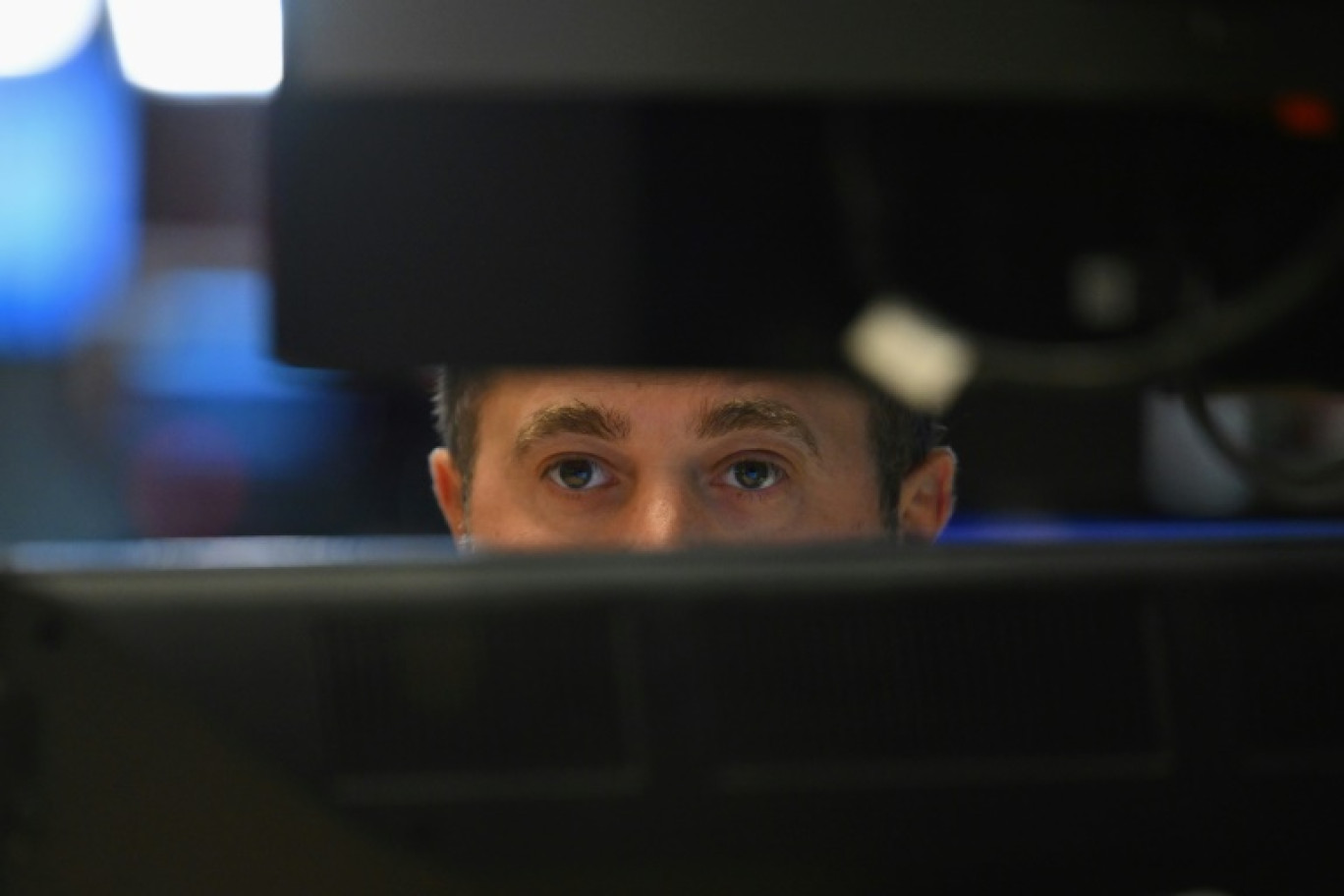 Un opérateur du New York Stock Exchange © ANGELA WEISS