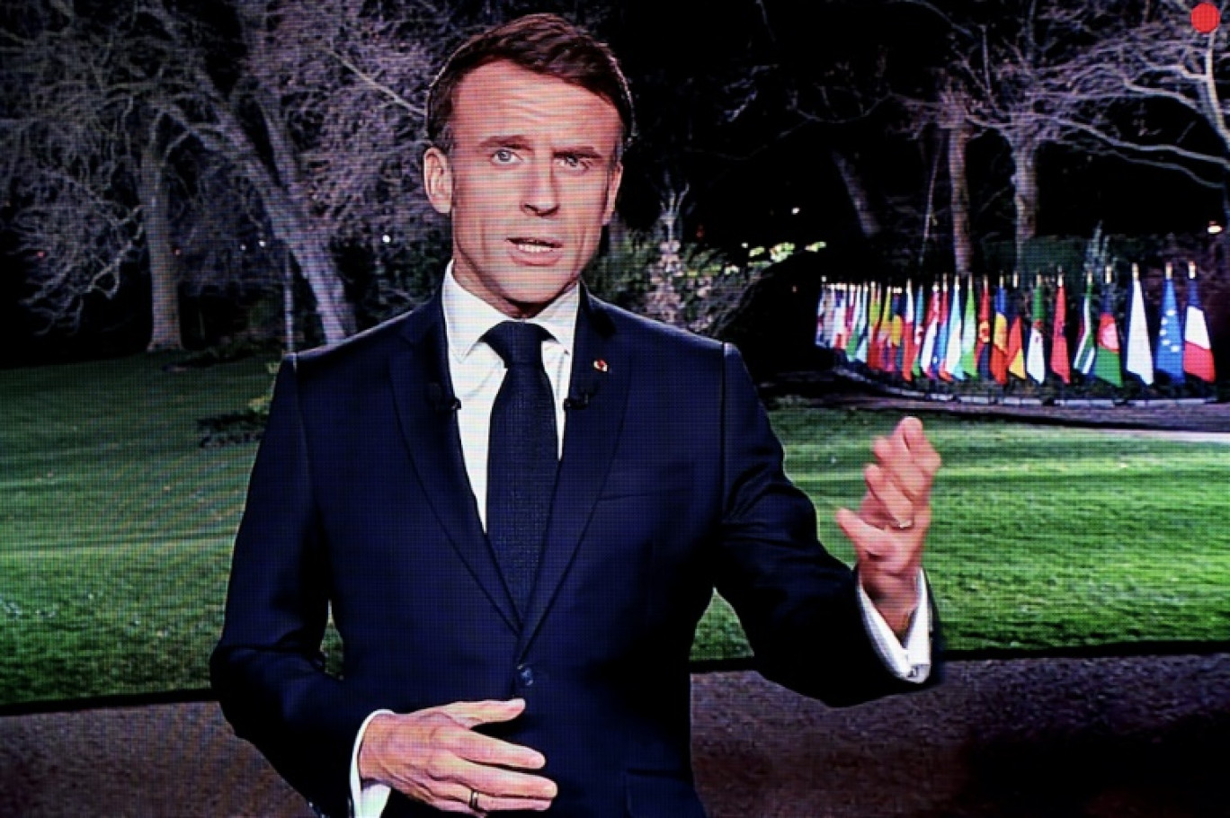 Le président Emmanuel Macron lors d'un  entretien sur TF1 et France 2 retransmis à la télévision, le 14 mars 2024 à Paris © Ludovic MARIN