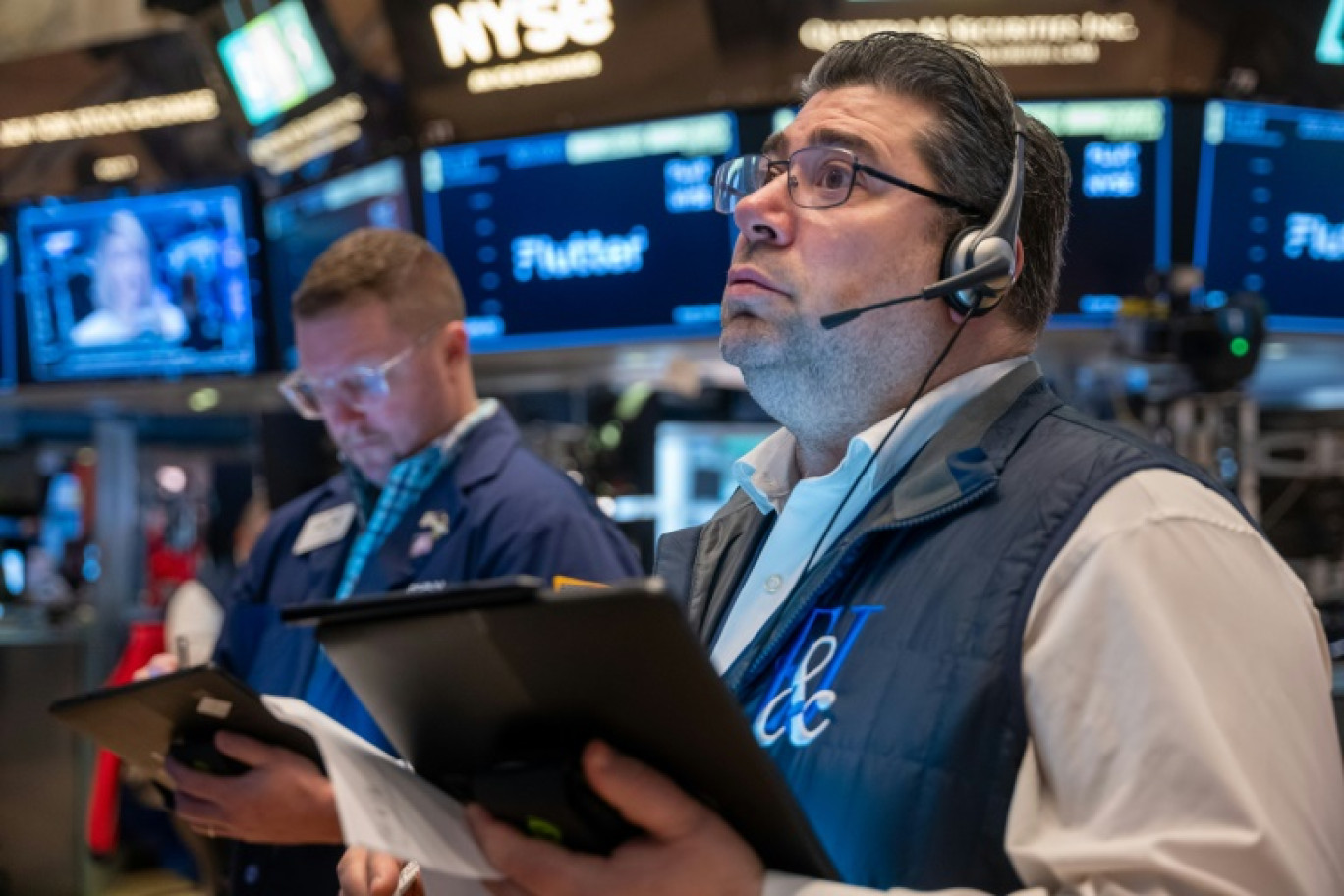 Des opérateurs du New York Stock Exchange © SPENCER PLATT