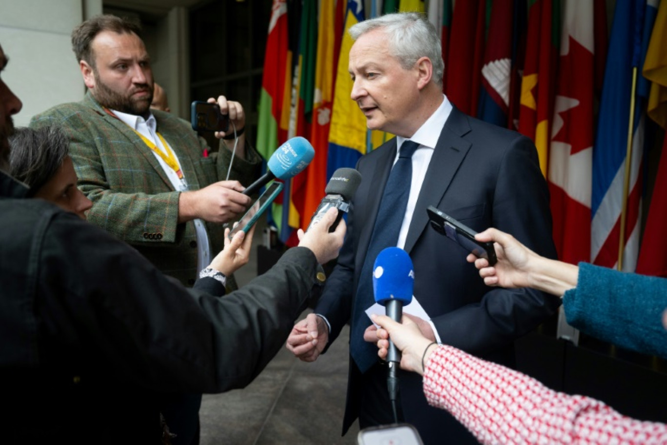 Fernando Haddad et Bruno Le Maire lors d'une conférence de presse au siège du FMI à Washington, le 17 avril 2024 © Jim WATSON