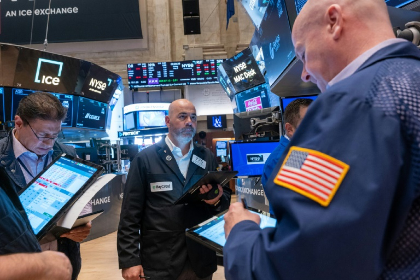 Des opérateurs du New York Stock Exchange © SPENCER PLATT