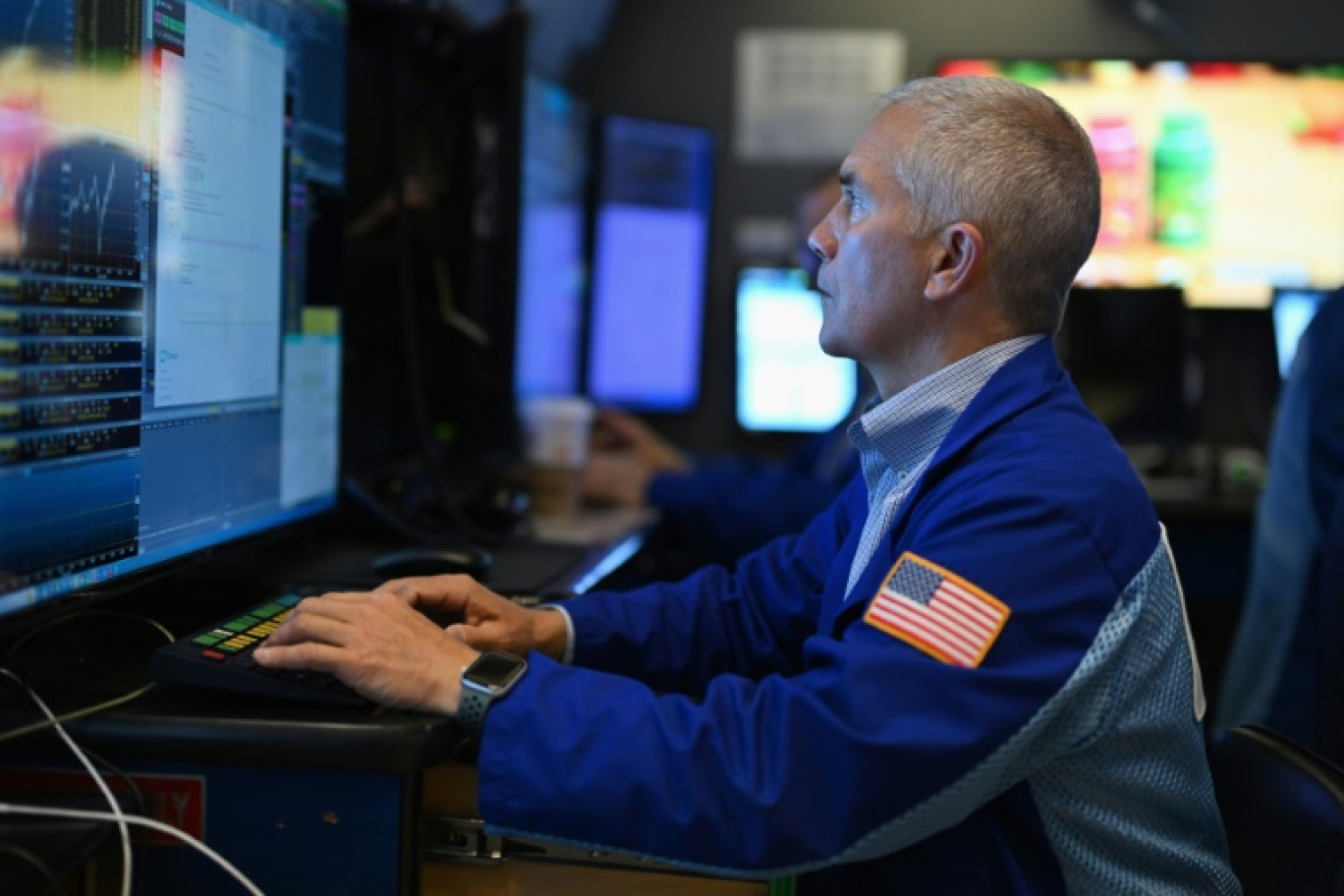 Un opérateur du New York Stock Exchange © ANGELA WEISS