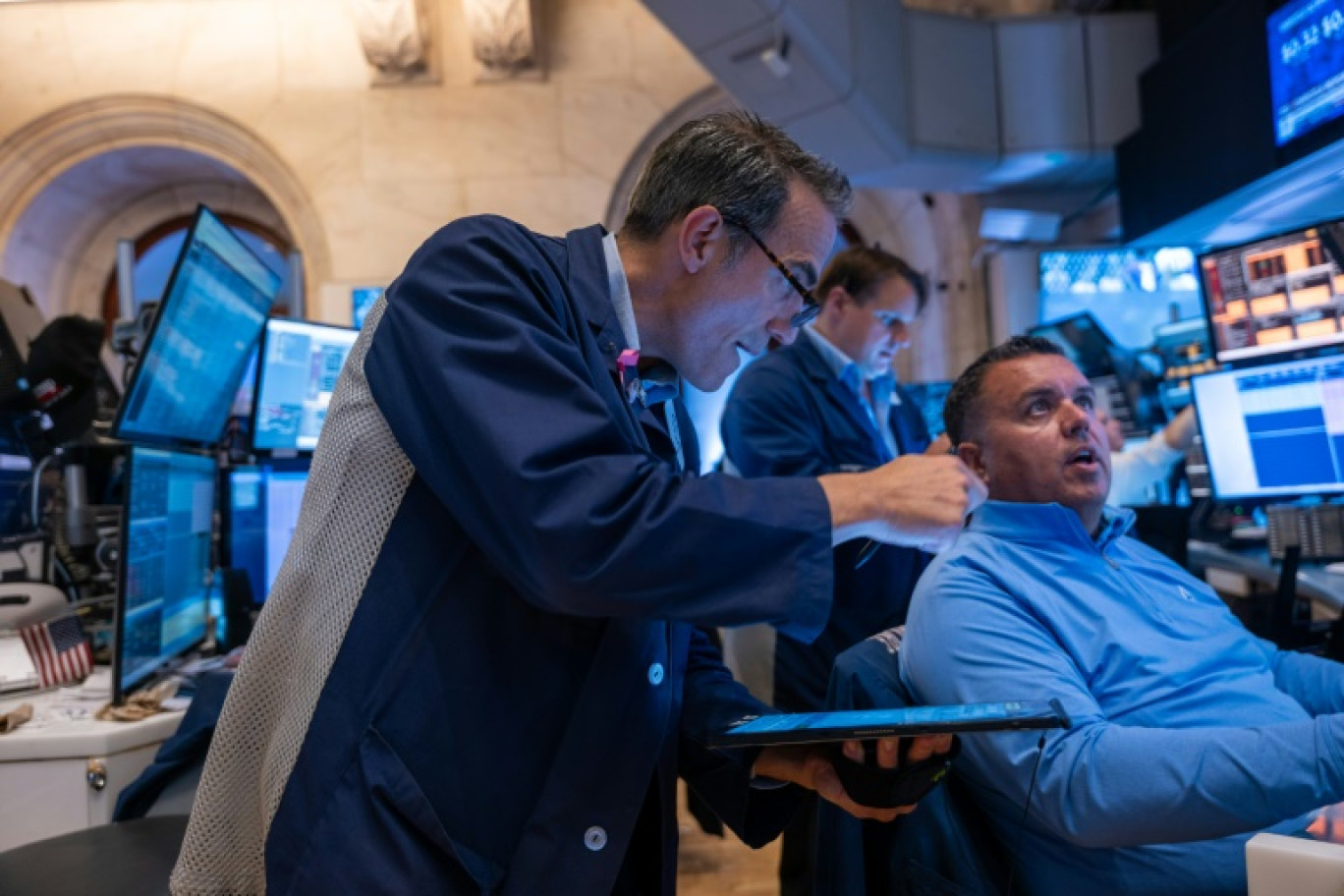 Des opérateurs du New York Stock Exchange © SPENCER PLATT