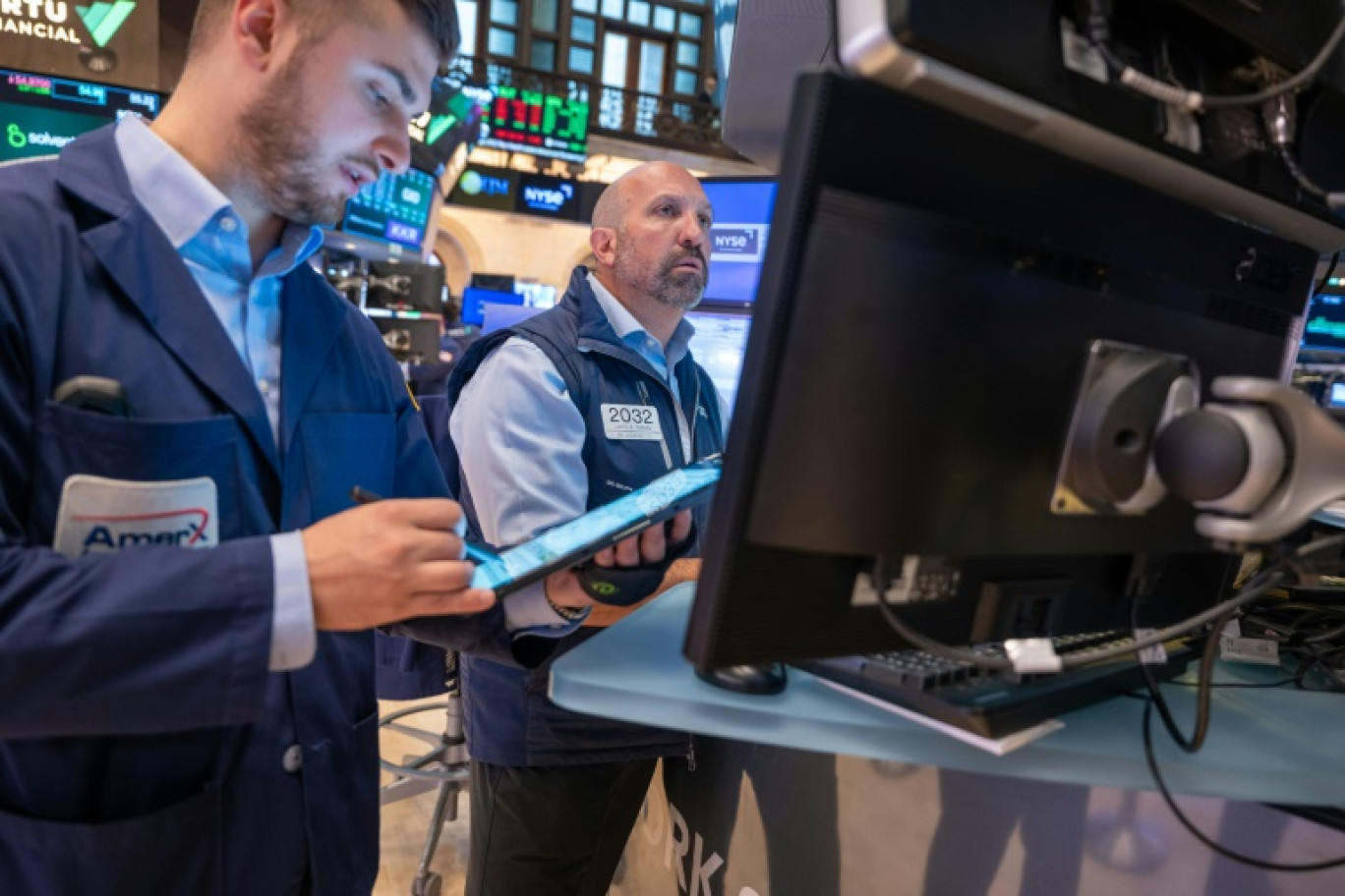 Des opérateurs du New York Stock Exchange © SPENCER PLATT