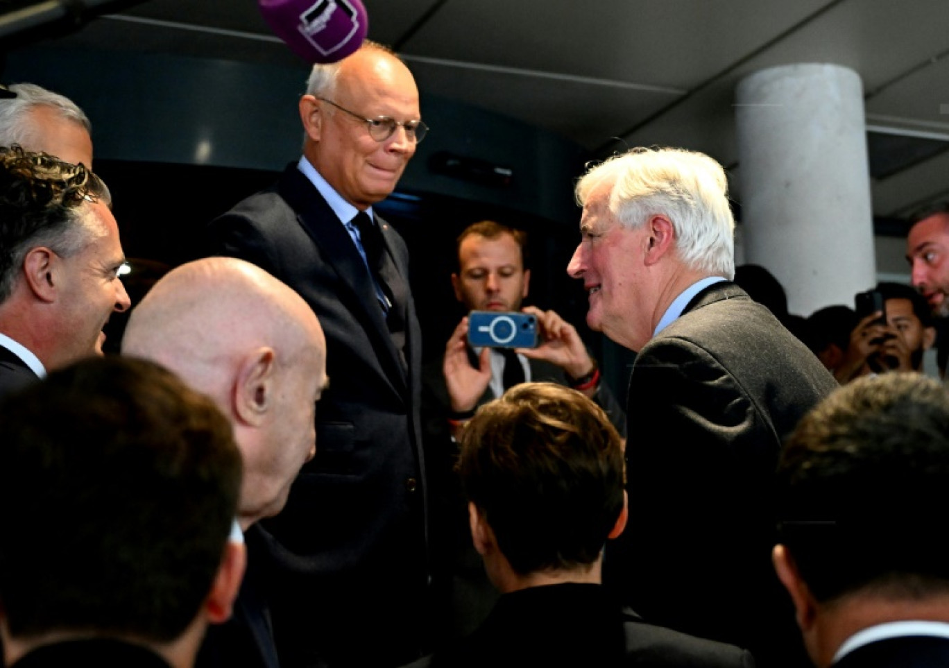 Le Premier ministre Michel Barnier (c) accuelli par le président de Horizons, Edouard Philippe (g), le 11 septembre 2024 à Reims © FRANCOIS NASCIMBENI