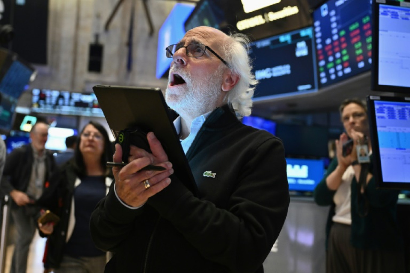 Un opérateur du New York Stock Exchange © ANGELA WEISS