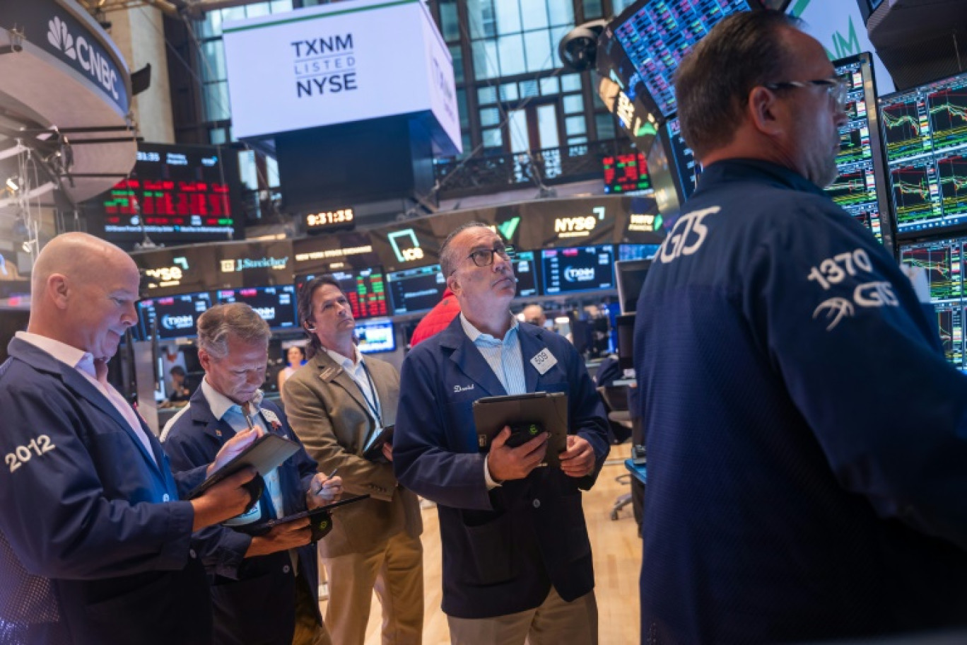 Des opérateurs du New York Stock Exchange © SPENCER PLATT