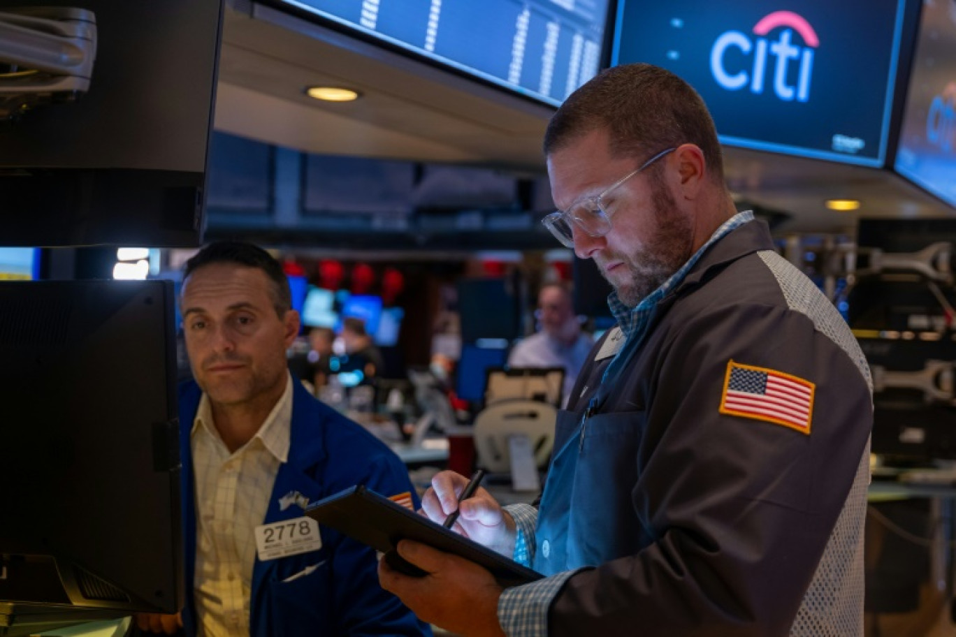 Des opérateurs du New York Stock Exchange © SPENCER PLATT