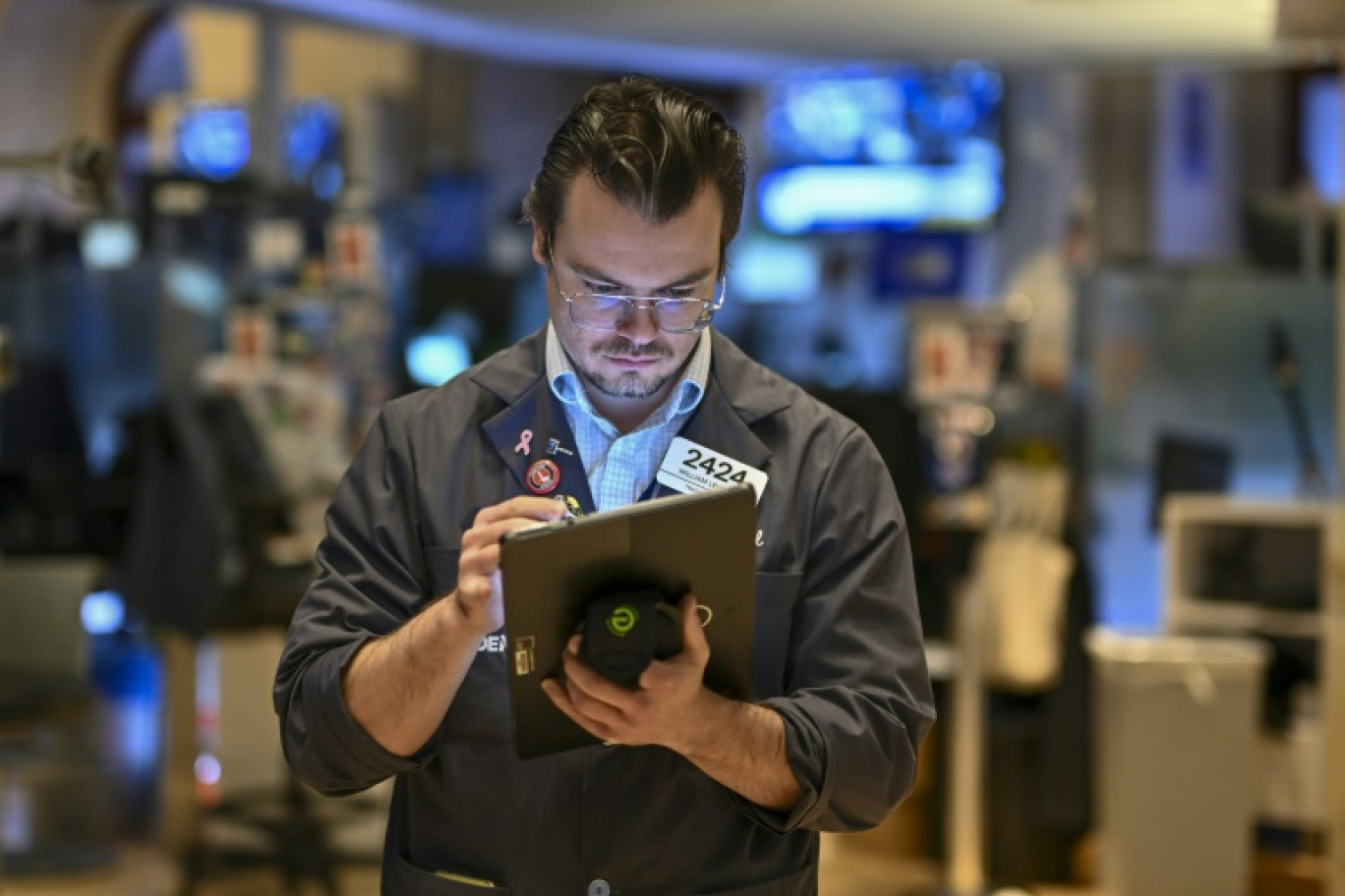 Un opérateur du New York Stock Exchange © ANGELA WEISS