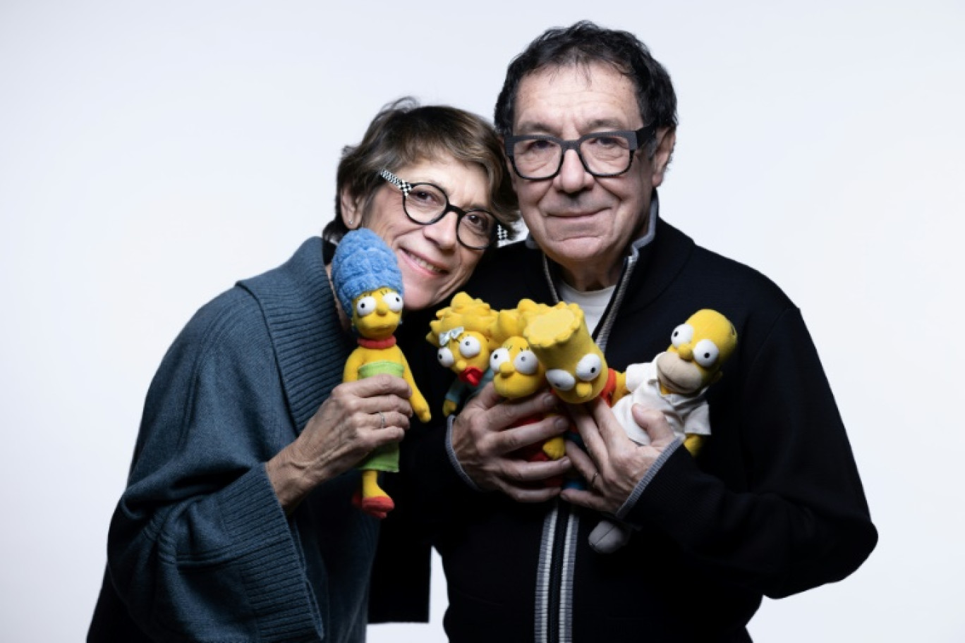 Les comédiens Véronique Augereau (g) et Philippe Peythieu, voix françaises de Marge et Homer Simpson, le 5 décembre 2024 à Paris © JOEL SAGET