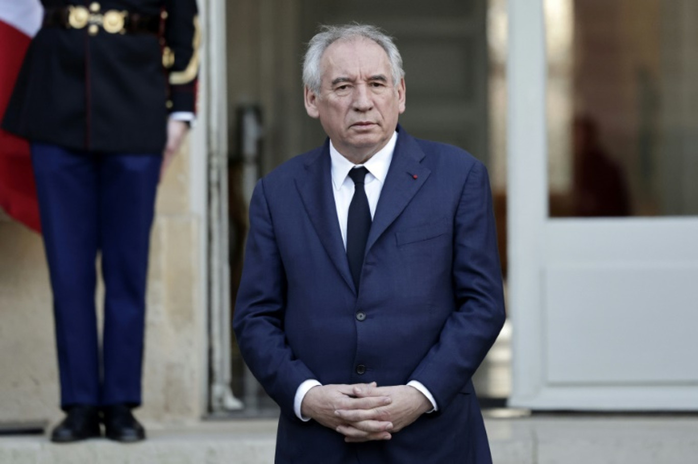 Le Premier ministre François Bayrou (c-g) lors d'une réunion avec les partenaires sociau au ministère du Travail, le 17 janvier 2025 à Paris © Bertrand GUAY